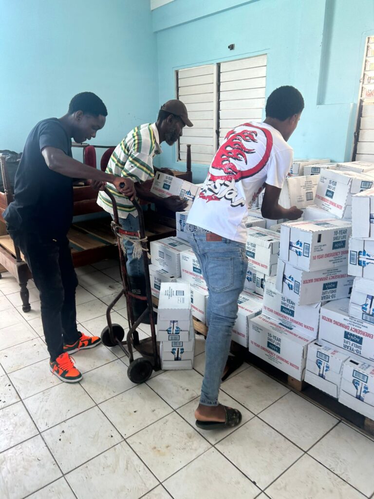 Through the kind coordination and advocacy of former Jamaican decathlete and Munro College Old Boy, Claston Bernard, the State of Louisiana in the United States of America has donated more than 60 pallets of drinking water and meals ready to eat (MREs) to the JN Foundation for distribution to affected communities and groups in parishes worst affected by Hurricane Melissa. Here, workmen unload vital supplies needed for the institutions. These supplies have been donated to the William Knibb High School in Trelawny, Candle in the Dark Homeless Shelter in Manchester, Belmont Academy in Westmoreland and first aid responders St John Ambulance Jamaica. These institutions will support further distribution of the items to vulnerable groups and communities.  Mr Bernard, an Olympian and Commonwealth gold medallist, attended the Louisiana State University and ran for a seat in the United States House of Representatives in 2021.   